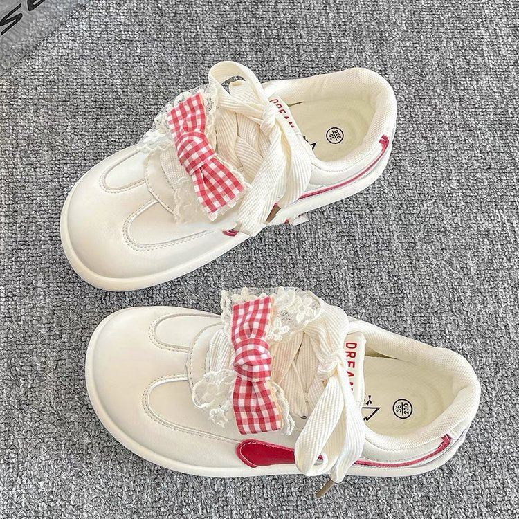Damen Sneakers mit verspieltem Rüschendetail und buntem Karostoffband EB