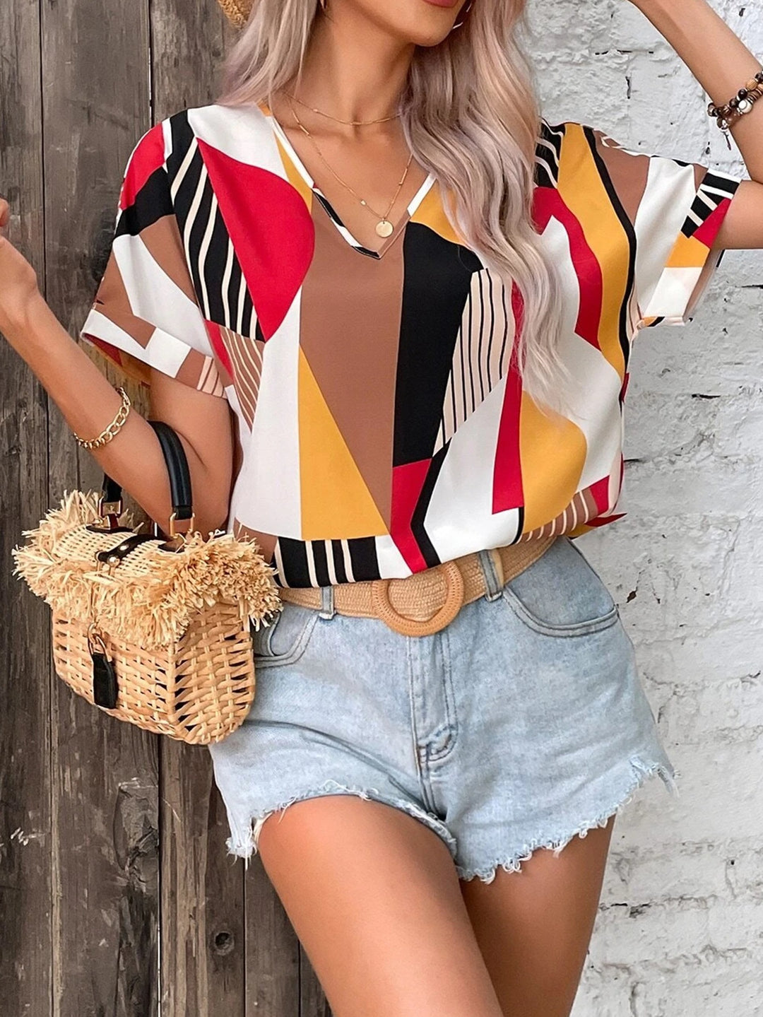 Damen V-Ausschnitt T-Shirt mit geometrischem Muster EB