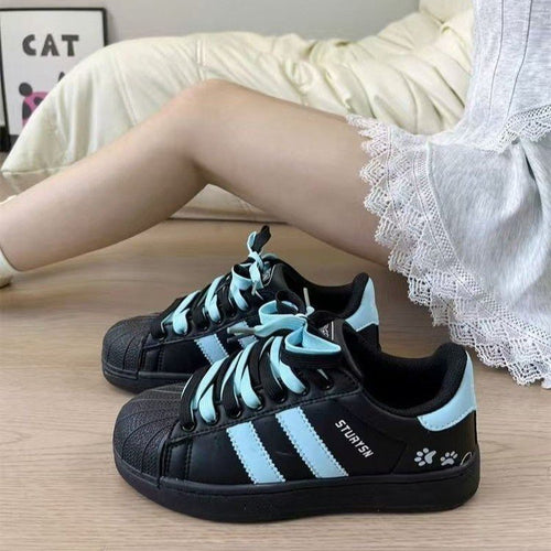 Damen Sneakers im sportlichen Retro-Design mit auffälligen Schnürsenkeln EB