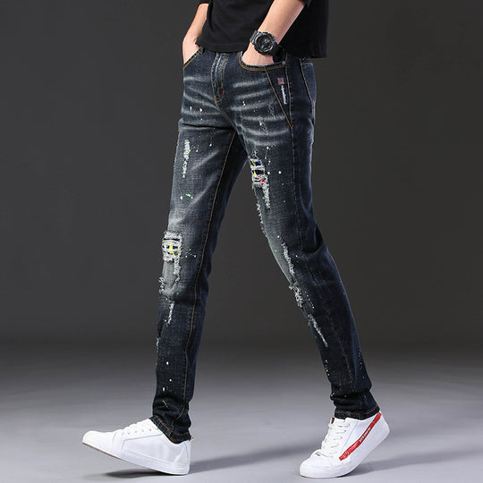 Herren Slim Fit Jeans mit kreativen Rissdesign und Farbklecksen EB