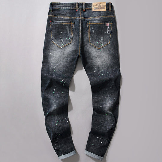 Herren Slim Fit Jeans mit kreativen Rissdesign und Farbklecksen EB