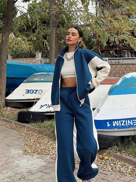 Damen athletisches Zweiteiler-Set aus strukturiertem Sweatstoff mit gekürzter Reißverschlussjacke und hochgeschnittener Jogginghose mit weitem Beinverlauf Eichborn Berlin