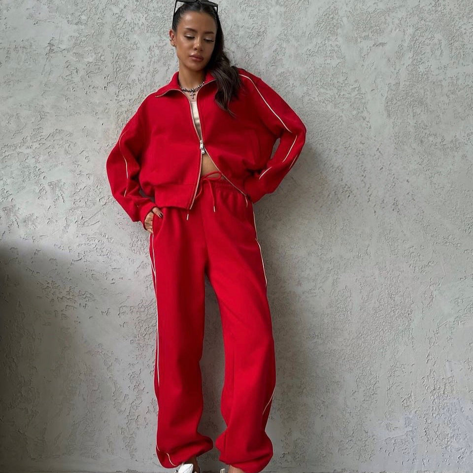 Damen lässiges Sweatset mit Stehkragen Reißverschluss gekürzter Jacke und hochtaillierter Schlaghose Eichborn Berlin
