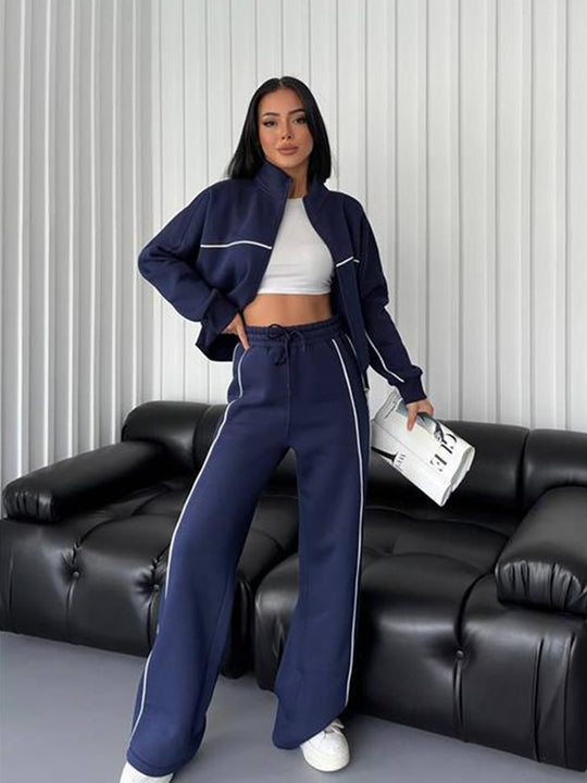 Damen lässiges Sweatset mit Stehkragen Reißverschluss gekürzter Jacke und hochtaillierter Schlaghose Eichborn Berlin