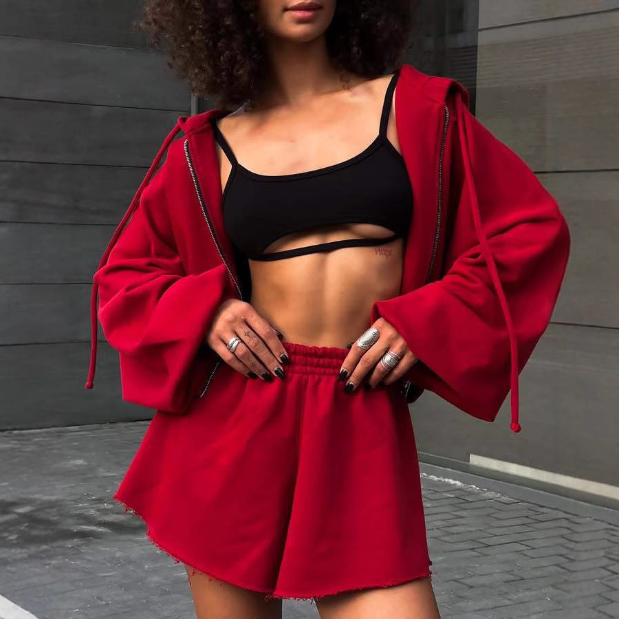 Damen oversized Cropped-Zip-Hoodie mit voluminösen Ballonärmeln und elastischer High‑Waist Loungeboxer-Shorts Eichborn Berlin