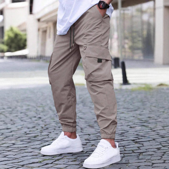 Herren nan technische Travel-Joggerhose mit integriertem Sicherheitsfach elastischem Tunnelzugbund und wasserabweisender Beschichtung EB