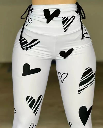 Damen Hochbund-Leggings mit grafischem Herzmuster und hochelastischem Material EB