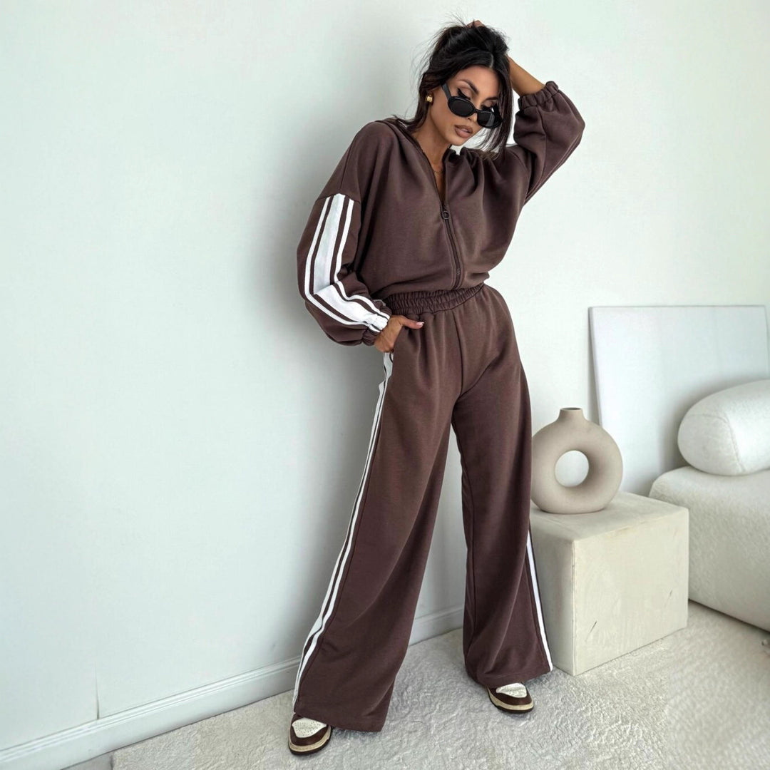 Damen cropped Zip-Hoodie mit voluminösen Ballonärmeln und High-Waist Relaxhose im sportlichen Seitenstreifen-Design Eichborn Berlin