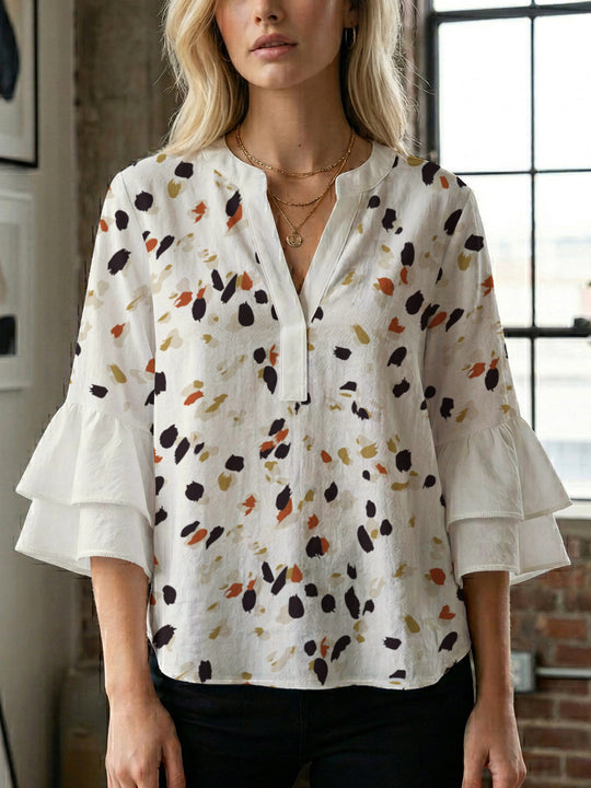 Damen Bluse mit voluminösen Rüschenärmeln und modernem Motiv EB