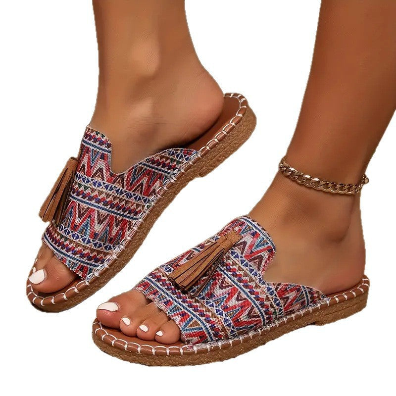 Damen Ethno-Slipper-Sandalen mit Quaste und handgenähter Ziernaht EB