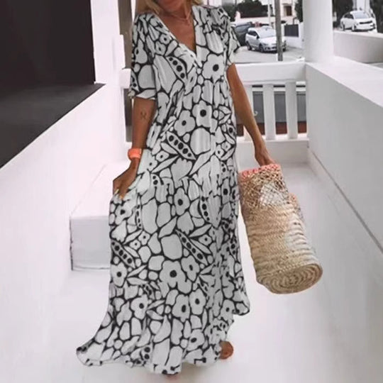 Damen Fließendes Maxikleid mit V-Ausschnitt und floralem Design EB