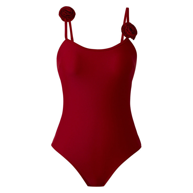 Damen Einteiler Badeanzug mit dekorativen Blumenapplikationen und elegantem Wickelrock EB