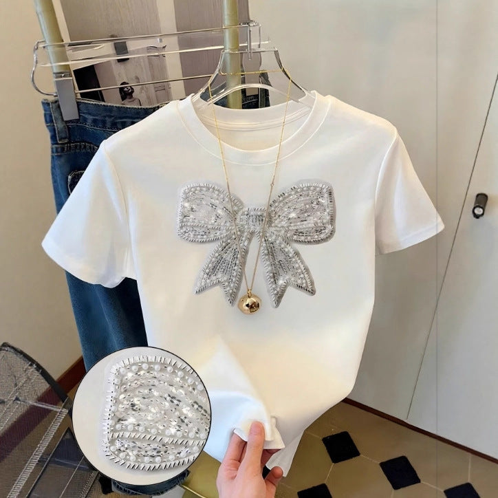 Damen T-Shirt mit glitzerndem Schleifenmotiv und feiner Sticktechnik EB