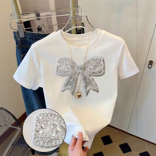 Damen T-Shirt mit glitzerndem Schleifenmotiv und feiner Sticktechnik EB