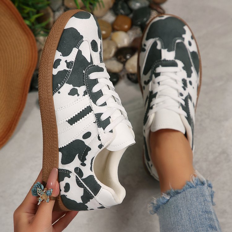 Damen Sportliche Sneakers mit trendigem Kuhdesign EB
