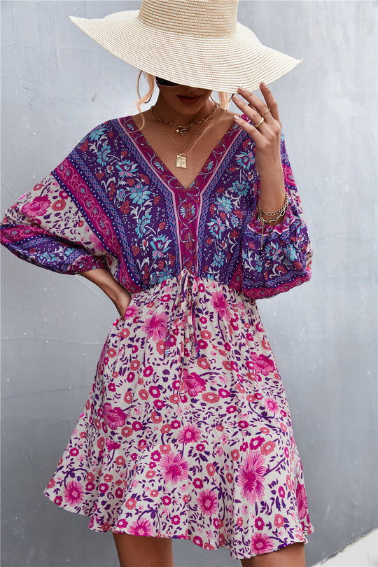 Damen Sommerliches Blusenkleid mit auffälligem floralen Muster und eleganten Puffärmeln EB
