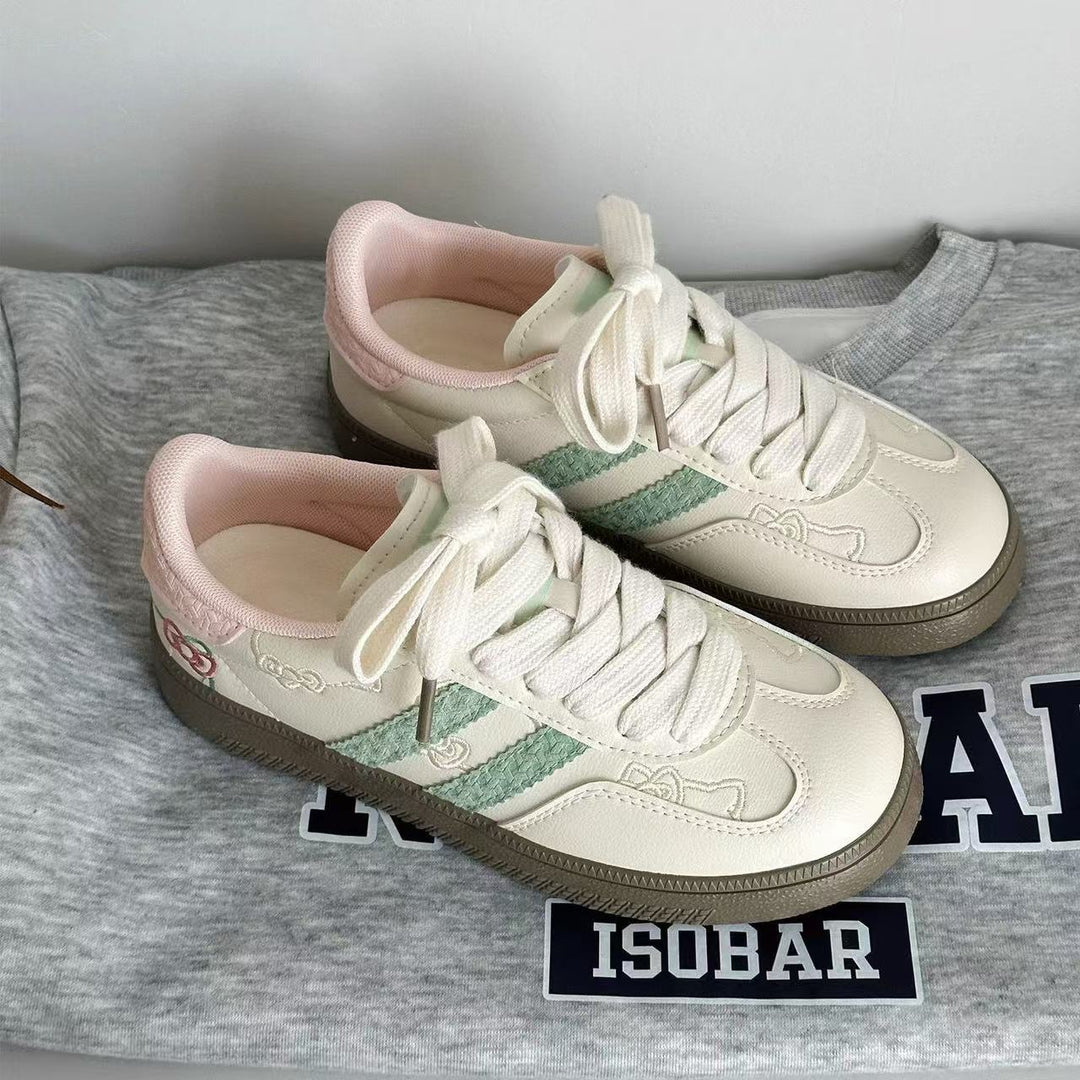 Damen Sneaker mit floralen Applikationen und elastischen Schnürsenkeln EB