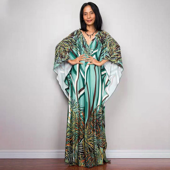 Damen Maxikleid mit kunstvollem Pfauenmuster und seitlichen Schlitzen Heidi Mode