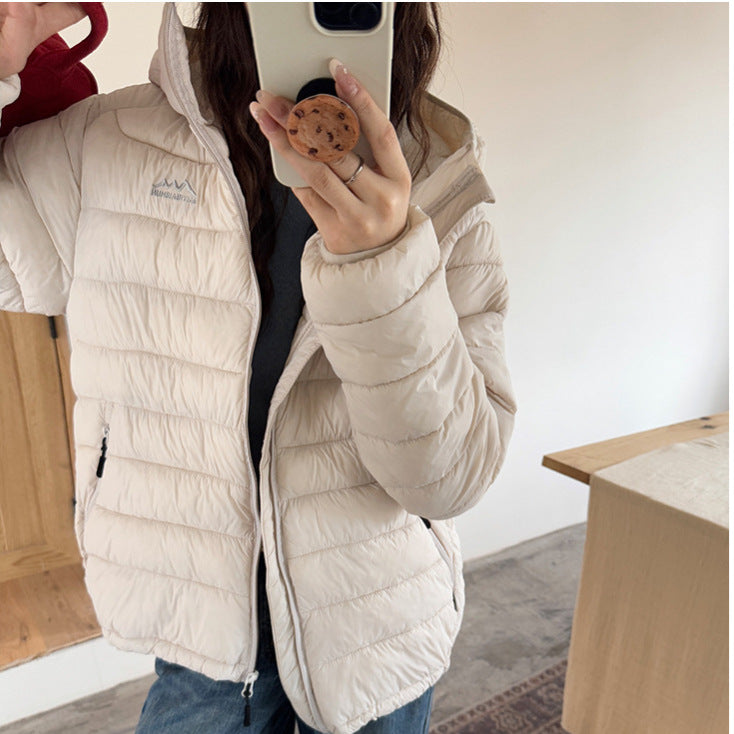 Damen ultraleichte Pufferjacke mit abnehmbarer Kapuze und elastischem Saum EB