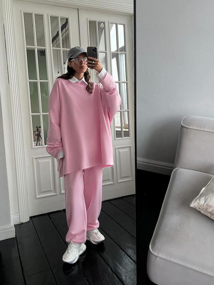 Damen oversized Lounge-Set mit ausgefranstem Saum, extra langem Sweatpullover und weiter hochgeschnittener Jogginghose EB