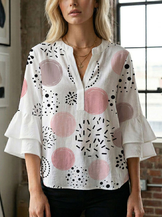 Damen Bluse mit voluminösen Flügelärmel und intensivem Blattmuster EB