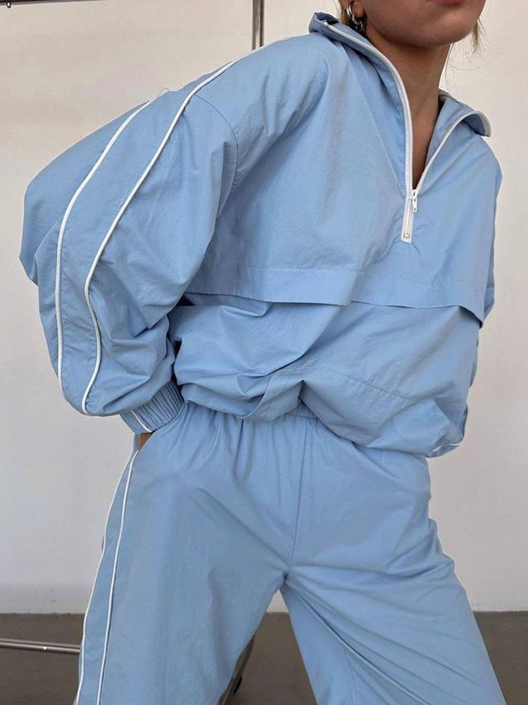 Damen winddichter Crop-Halfzip-Trainingsanzug mit elastischem Bund und kontrastierender Paspel Eichborn Berlin