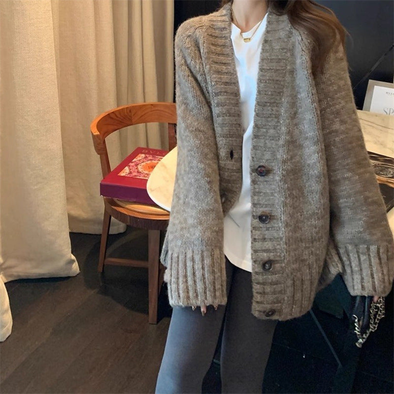 Damen Grobstrickjacke mit voluminösen Ärmeln und knöpfbarem Ausschnitt EB