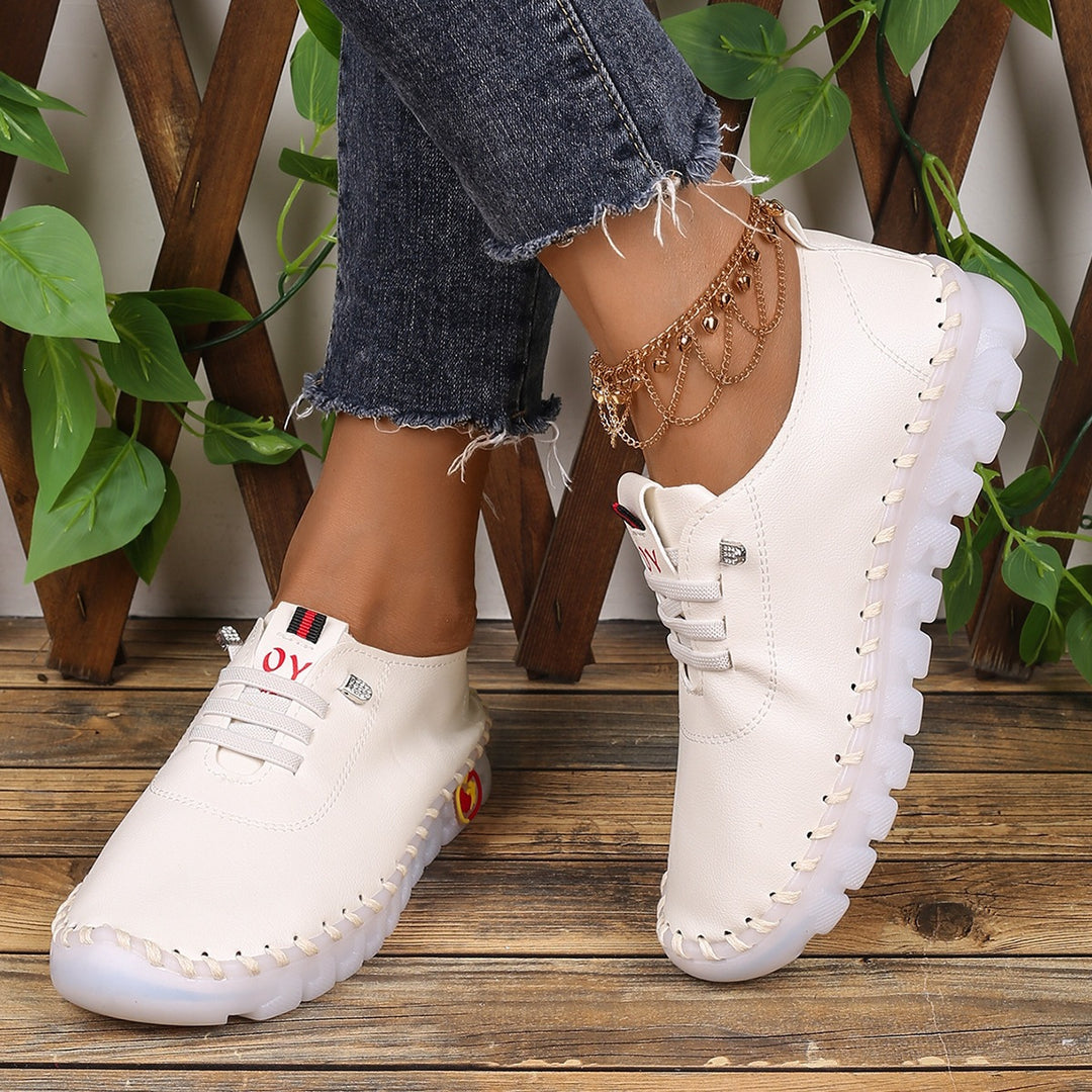Damen Bequeme Lederoptik-Slipper mit flexibler Profilsohle und Mokassin-Naht EB