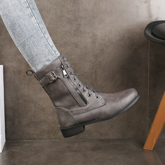 Damen nan knöchelhohe Vintage-Lederoptik Combat-Stiefelette mit seitlichem Reißverschluss, dekorativem Schnallenriemen und leichtem Blockabsatz EB