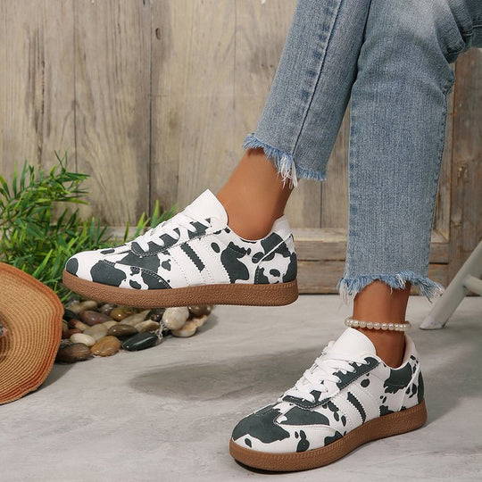 Damen Sportliche Sneakers mit trendigem Kuhdesign EB