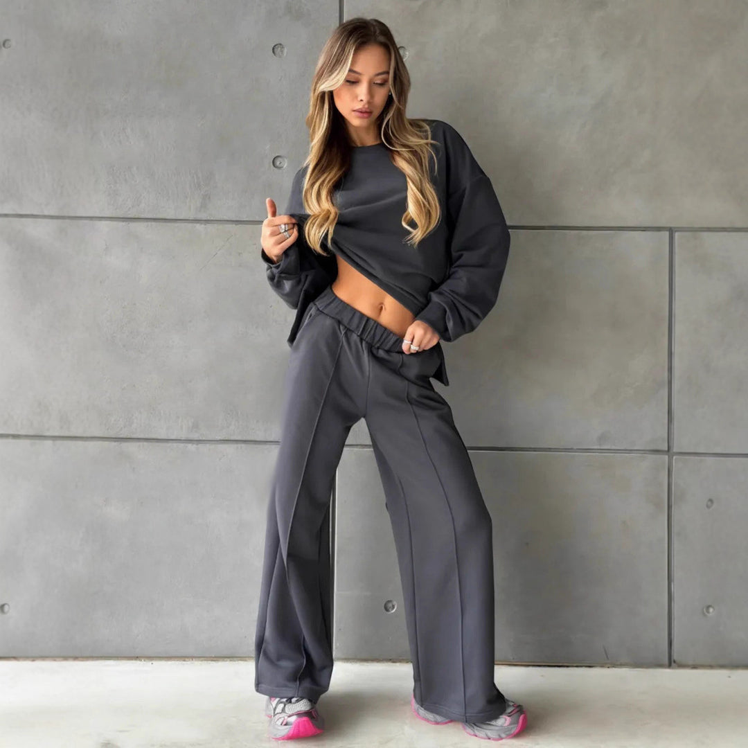 Damen eleganter Lounge-Zweiteiler mit Oversize-Sweatshirt und taillierter Weitbein-Hose Eichborn Berlin