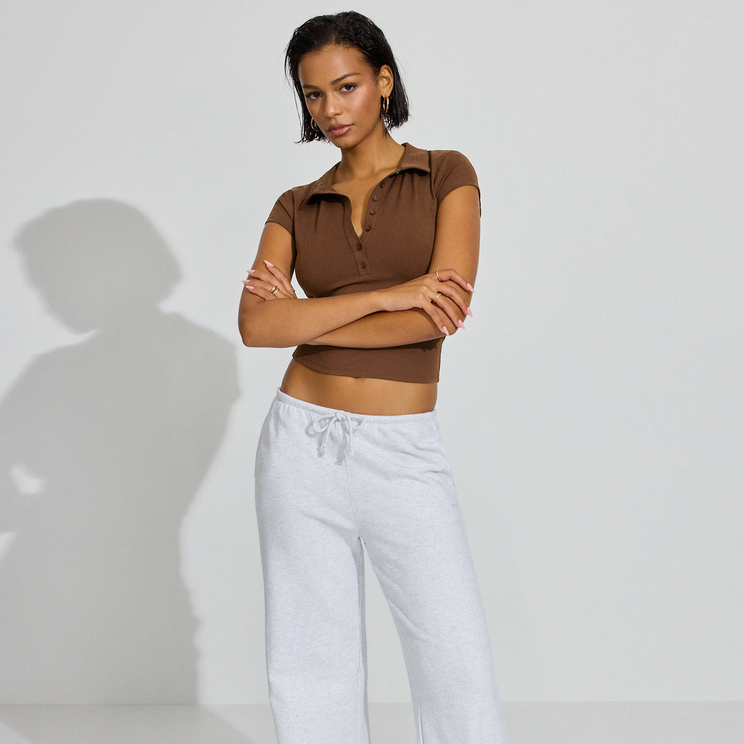 Damen Polo-Shirt mit kurzem Schnitt und modischer Knopfleiste EB