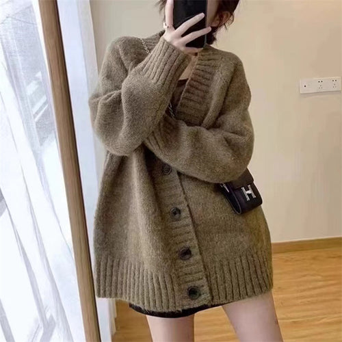 Damen Grobstrickjacke mit voluminösen Ärmeln und knöpfbarem Ausschnitt EB