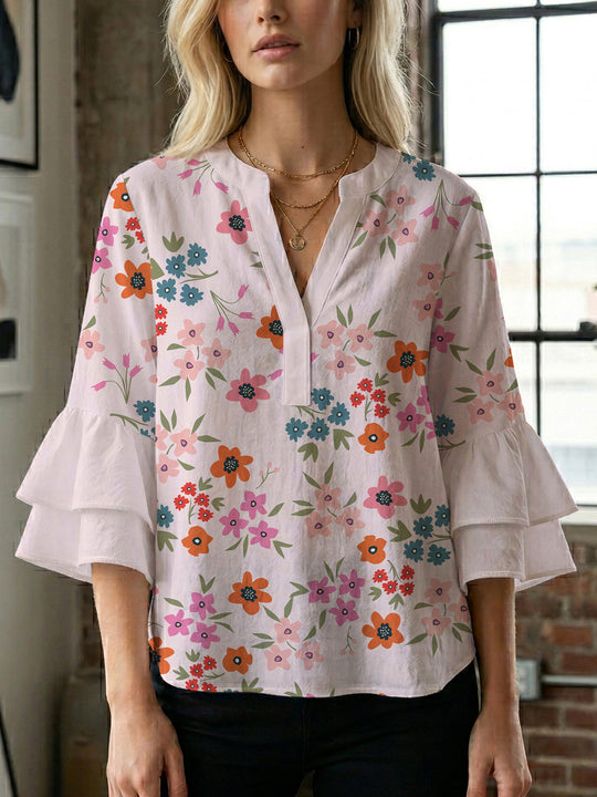 Damen Bluse mit voluminösen Flügelärmel und intensivem Blattmuster EB