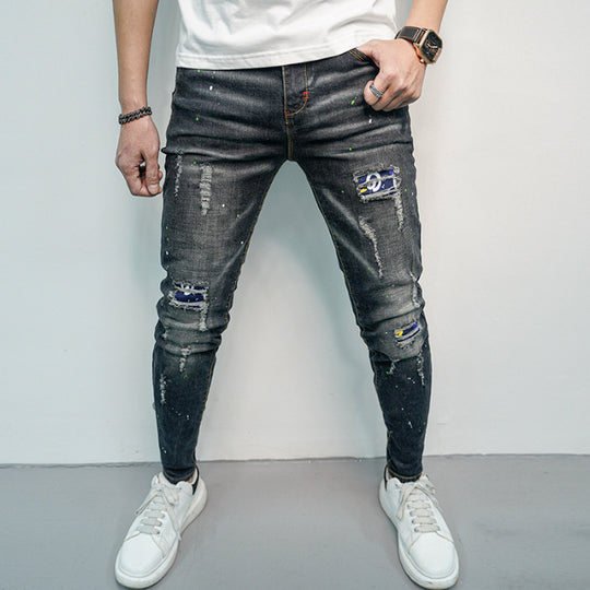 Herren Skinny Fit Jeans im kreativen Rissdesign und bunten Farbsklecks EB