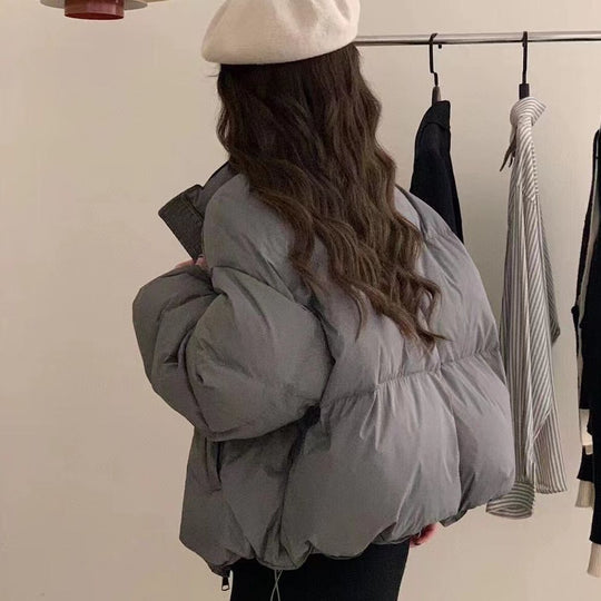 Damen Oversized Pufferjacke mit elastischem Bund und seitlichen Reißverschlusstaschen EB