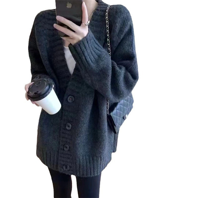 Damen Grobstrickjacke mit voluminösen Ärmeln und knöpfbarem Ausschnitt EB