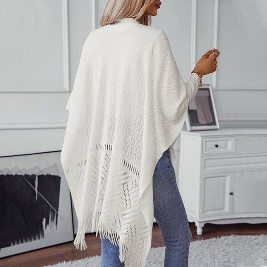 Damen eleganter Strickponcho mit fransigen Details und markantem Muster EB