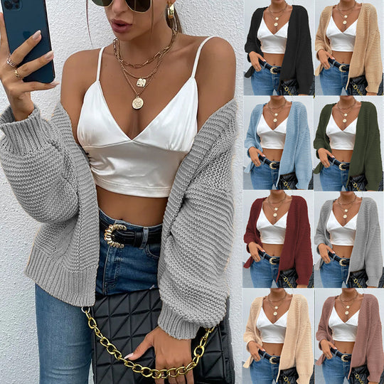 Damen Strickjacke mit voluminösen Ärmel und stylischem Rippenmuster EB