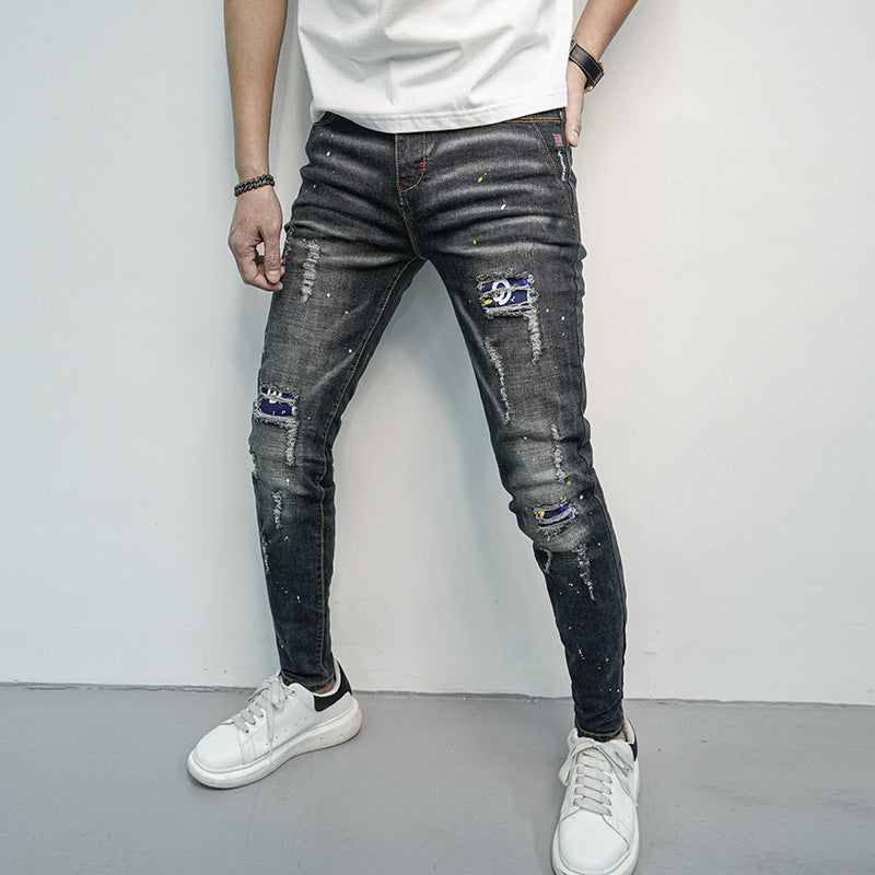Herren Skinny Fit Jeans im kreativen Rissdesign und bunten Farbsklecks EB