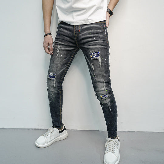 Herren Skinny Fit Jeans im kreativen Rissdesign und bunten Farbsklecks EB