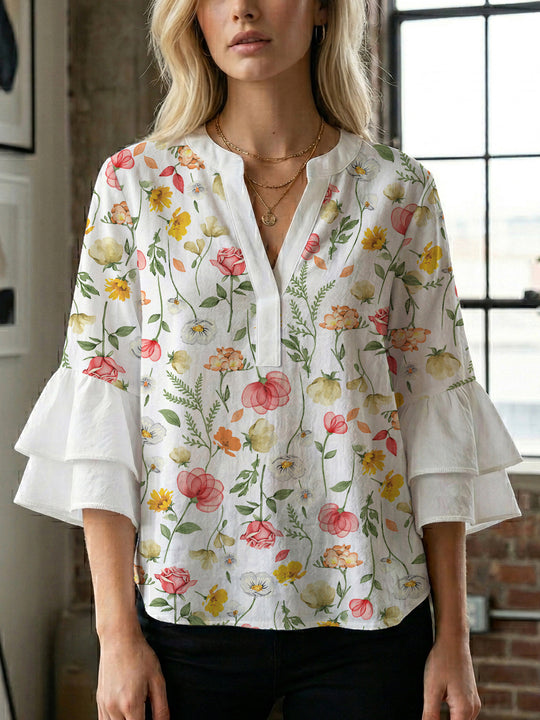 Damen Bluse mit voluminösen Ärmeln und floralem Design EB
