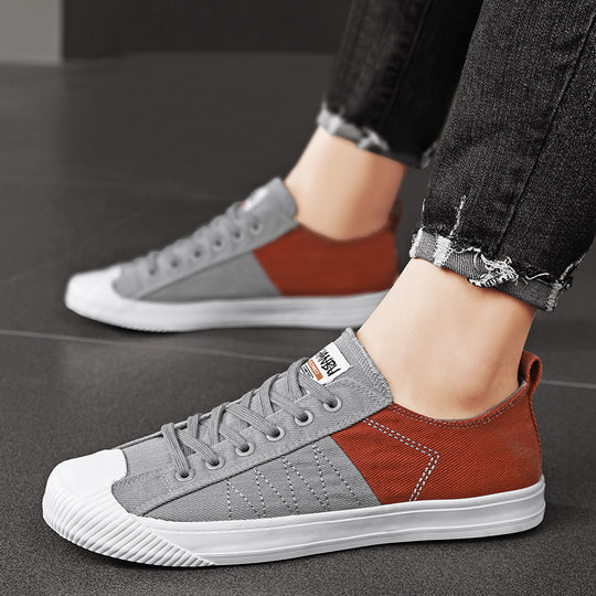 Unisex niedrige Canvas-Sneaker mit verstärkter Gummi-Zehenkappe und kontrastierenden Textilpaneelen EB