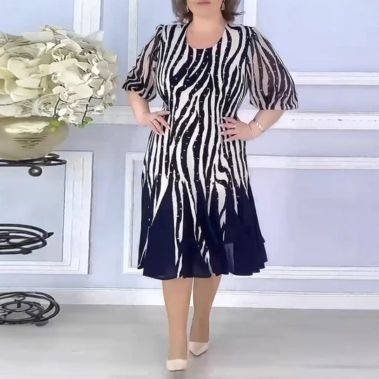 Damen Midikleid mit voluminösen Puffärmeln und dynamischem Streifenmuster Heidi-Mode