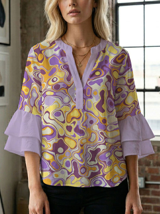 Damen Bluse mit voluminösen Flügelärmel und intensivem Blattmuster EB