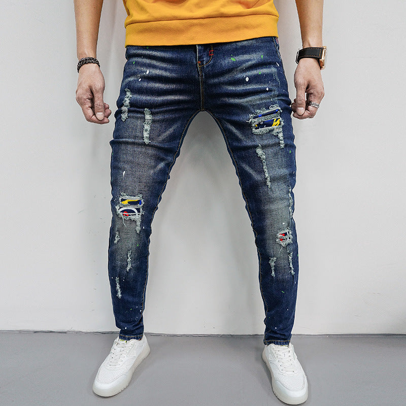Herren Skinny Fit Jeans mit kreativen Farbklecksen und Rissdesign EB