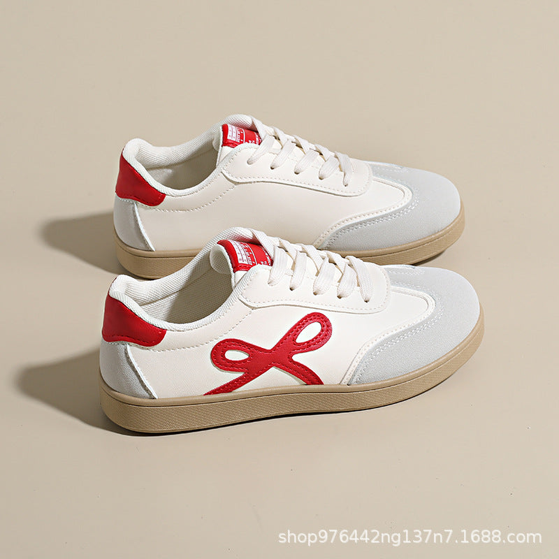 Damen Sneakers im sportlichen und eleganten Design mit rosa Akzenten EB