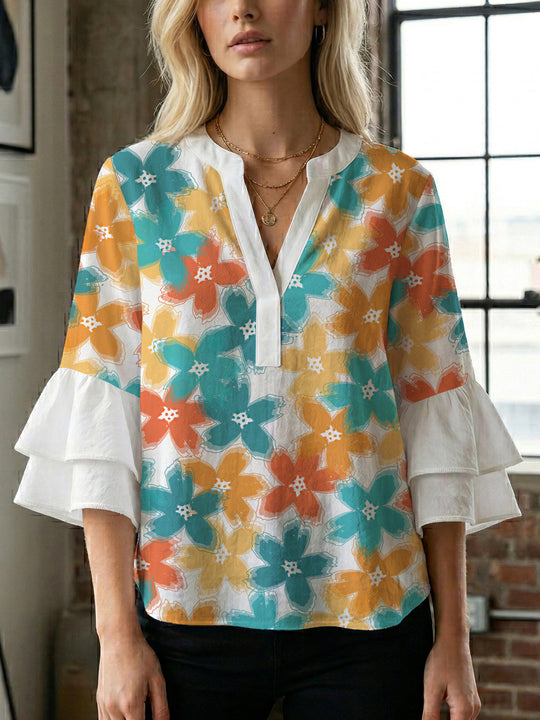 Damen Bluse mit voluminösen Ärmeln und floralem Design EB