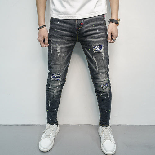 Herren Skinny Fit Jeans im kreativen Rissdesign und bunten Farbsklecks EB