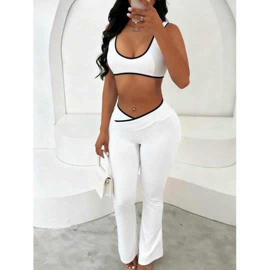 Damen Sportliches Zweiteiler Set mit kurzer Oberteil und flared Leggings EB